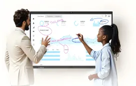 a student is talking about a trend with her teacher in front of a bulletin board