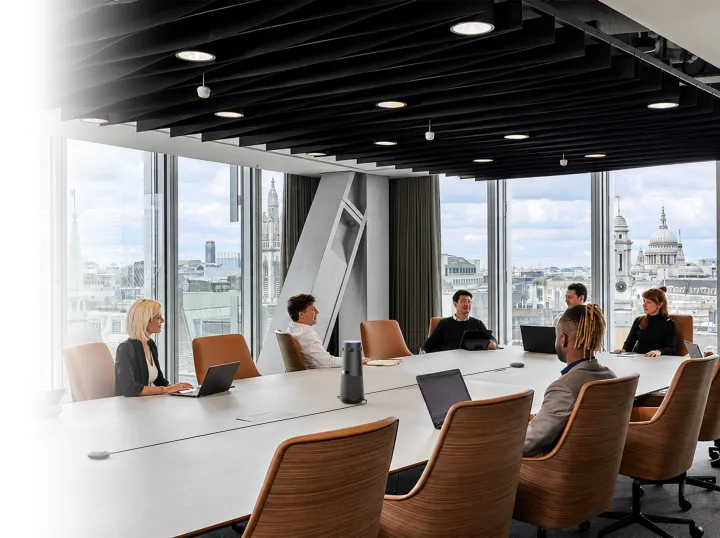 All-in-one meeting solution deployed in a modern corporate boardroom, demonstrating flexible audio coverage for all room sizes without IT retrofits.