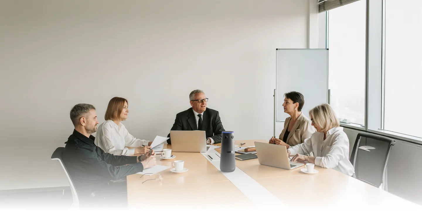 Several people in a conference room using Nearity 360 Alien Conference Camera for office in a meeting