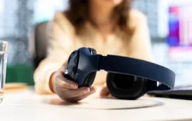 a white woman is using her new best earbuds for call quality