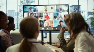 diverse team workers reviewing project updates together with shareholders