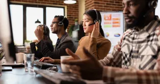 Four people are talking using best earbuds for team calls