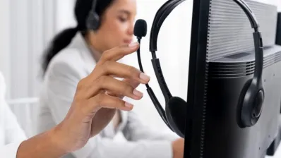 Remote professional wearing ENC headset during online meeting