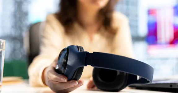 this business woman is grabbing her best earbuds for call quality