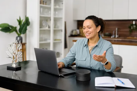 A woman having an online meeting from home