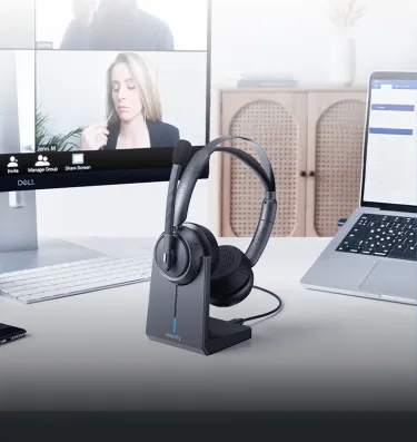 Over ear noise cancelling headphones for work from home set up on a dual-monitor office table.