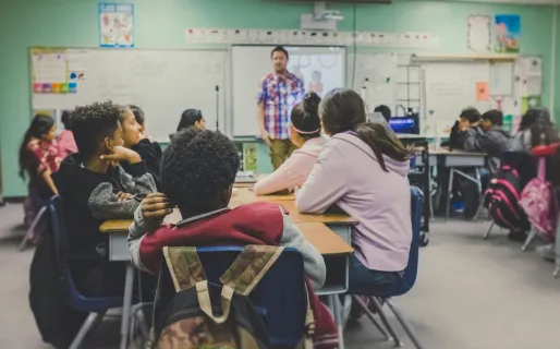 A female teacher leading an educational whiteboard game