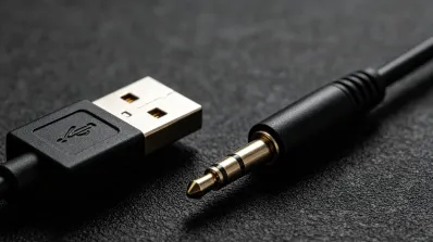 Close-up comparison of USB connector and 3.5mm audio jack