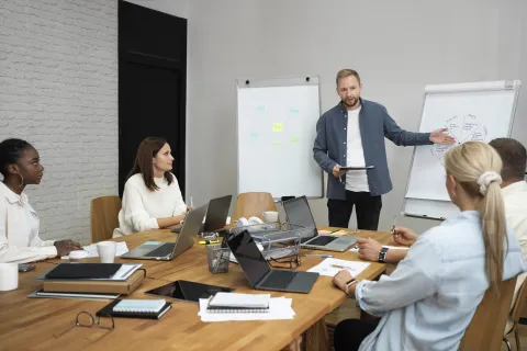 People participating in a hybrid meeting.
